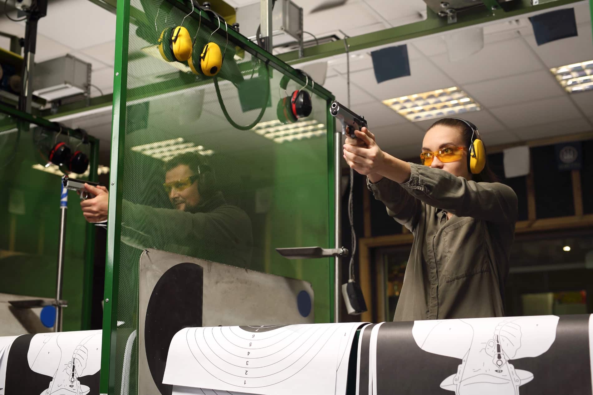 man and woman at shooting range